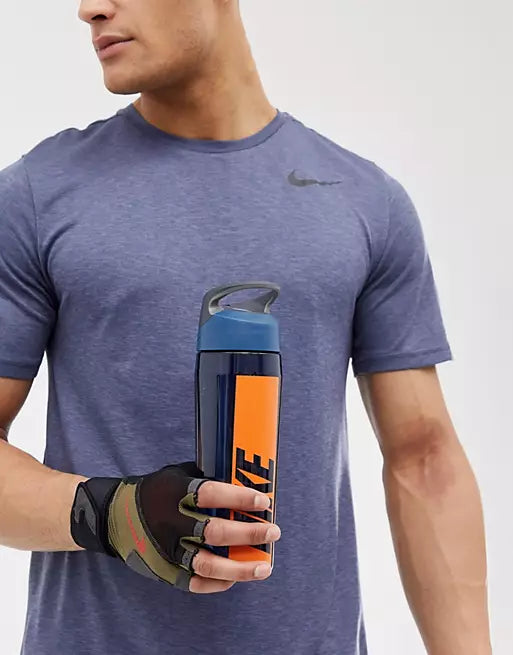 Nike water bottle, held by a man in athlesuire.
